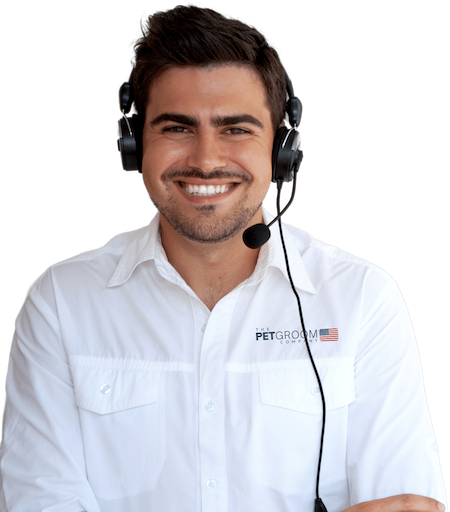 A smiling man wearing a headset and a Pet Groom Company shirt